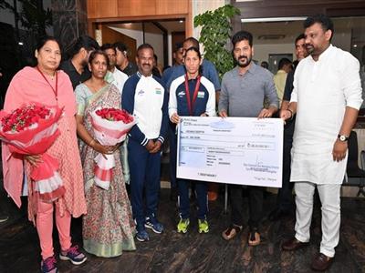 Telangana CM Revanth Reddy hands over cheque for Rs 1 crore to Paralympic bronze medallist Deepthi Jeevanji