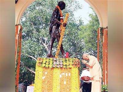 Uttar Pradesh CM Yogi Adityanath, ministers of his cabinet pay floral tributes to Mahatma Gandhi