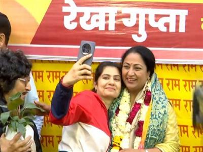 People gathered to greet newly appointed Delhi CM at her residence